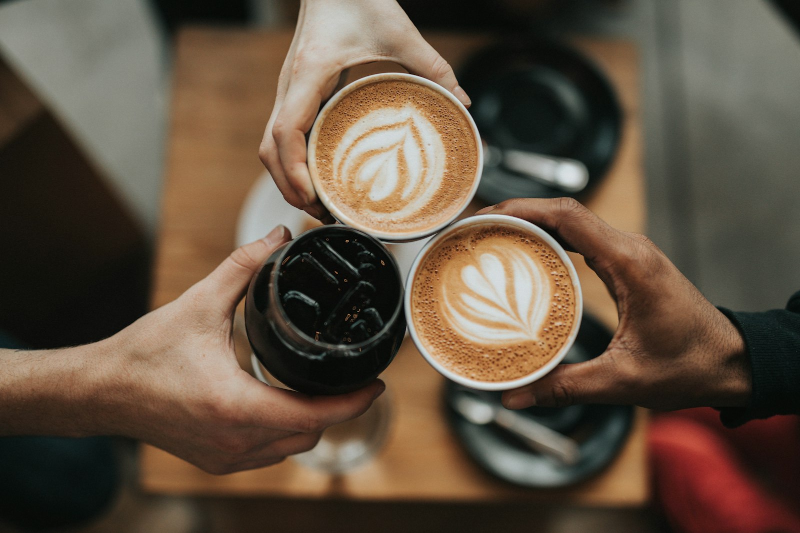 Friends toasting with coffee cups